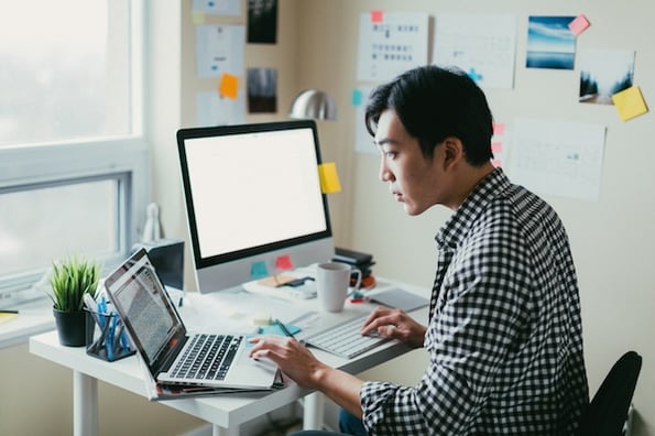 freelancer applying on his laptop, man working on his laptop